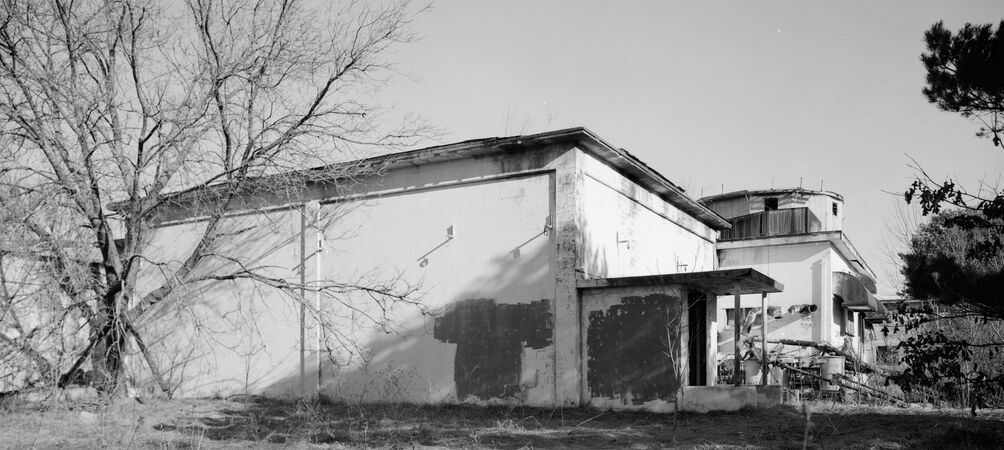 Custer AFS Radar Operations Building and FST-2 Addition with portions of the Power Building and FPS-20 Radar Tower in the Background, after Closure.